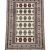 Hand-knotted tribal rug featuring ivory and cream central field with repeating burgundy and black geometric Gul medallions and a multi-layered ornamental border.