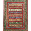 Full view of a 4' 11" x 6' 5" hand-knotted Afghan wool rug featuring a repeating "Gul" (elephant footprint) geometric pattern on a deep madder red field.