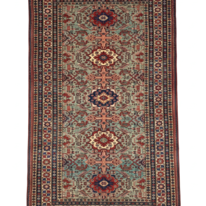 Full view of a 4' 7" x 7' 2" hand-knotted Persian Ardabil rug featuring a repeating geometric diamond medallion design on an ivory and terracotta field.