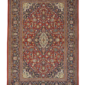 Full view of a 4' 8" x 6' 7" hand-knotted Persian Kashan rug with a large central floral medallion on a deep madder red field and navy borders.