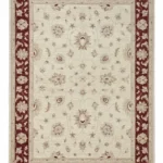 Full overhead view of a rectangular hand-knotted Afghan Chobi wool rug with a cream field and a bold burgundy floral border.