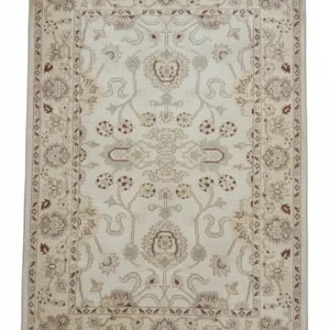 Full overhead view of a rectangular hand-knotted Afghan Chobi wool rug featuring a cream field with soft tan and burgundy floral patterns.