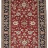 Full overhead view of a rectangular hand-knotted India Mashad wool rug with a deep red field and intricate floral vine patterns and a navy border.