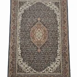 Full overhead view of a rectangular hand-knotted Indian Bijar wool rug featuring a dense navy field with a central tan diamond medallion and ornate borders.
