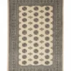 Full overhead view of a rectangular hand-knotted Pakistan Bokhara wool rug with a cream field and repeating charcoal and gold "elephant foot" medallions.