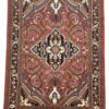 Full overhead view of a rectangular hand-knotted Persian Lilian wool rug with a vibrant rose-pink field and a central navy and cream floral medallion.