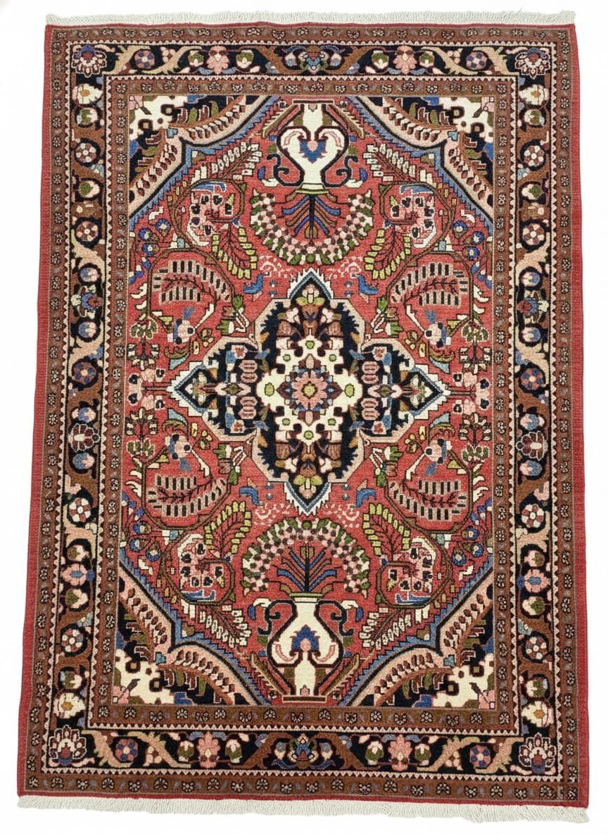 Full overhead view of a rectangular hand-knotted Persian Lilian wool rug with a vibrant rose-pink field and a central navy and cream floral medallion.
