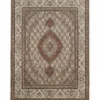 Full overhead view of a rectangular hand-knotted Persian Mahi wool rug with a cream field, central rust-colored diamond medallion, and intricate all-over floral patterns.