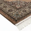 Detailed corner view of a Russian Ghafghaz rug showing the complex floral border and clean white hand-bound fringe.
