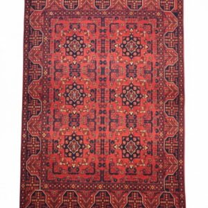 Full overhead view of a rectangular hand-knotted Afghan Khal Mohammad wool rug with a deep madder red field and repeating navy geometric medallions.