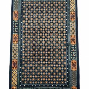 Full top-down view of a rectangular hand-knotted Tibet wool rug with a navy blue field and an orange and gold geometric tile pattern.