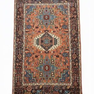 Full top-down view of a rectangular hand-knotted Persian Gharacheh wool rug featuring three primary geometric medallions on a vibrant terracotta orange field.