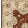 Detailed corner view of an India Chobi rug showing the wide botanical border and clean white hand-bound fringe.