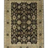 Full overhead view of a 5' 5" x 7' 11" hand-knotted Indian wool rug with a dark navy field, ivory central medallion, and ornate floral borders.