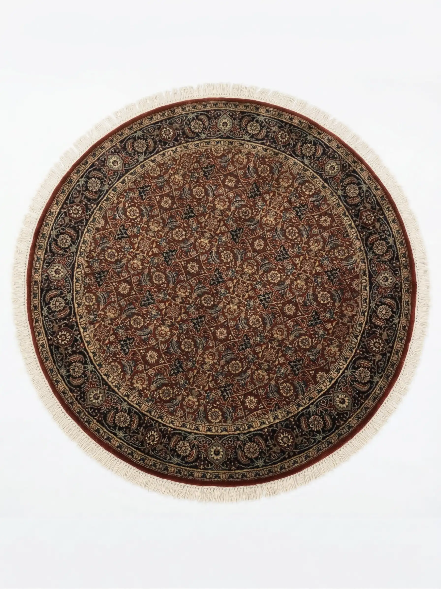 Full overhead view of a 5' x 5' circular hand-knotted Indian wool rug with a rich burgundy field and ornate navy floral borders.