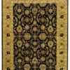 Full overhead view of a rectangular 6' x 8' 8" hand-knotted Indian wool rug with a deep black field and an ornate golden yellow floral border.