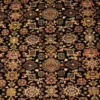 Macro shot showing the dense hand-knotted wool pile and intricate floral patterns in gold and terracotta on a black background.