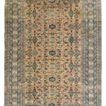 Full overhead view of a rectangular 5' 7" x 8' 2" hand-knotted Persian Ardabil wool rug with a detailed central medallion and symmetrical floral field.
