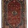 Full overhead view of a rectangular 5' 11" x 8' hand-knotted Persian Qashqai wool rug with a rich red field and three central navy geometric medallions.