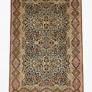 Full overhead view of a 4' 9" x 7' 8" hand-knotted Persian Kerman wool rug with a navy field and intricate ivory and gold floral scrollwork.
