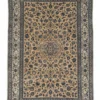 Full overhead view of a 5' 8" x 9' 5" hand-knotted Persian Lori wool rug with a sand-toned field and intricate navy floral patterns.