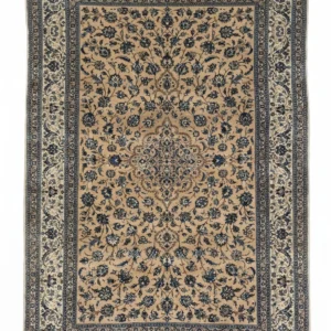 Full overhead view of a 5' 8" x 9' 5" hand-knotted Persian Lori wool rug with a sand-toned field and intricate navy floral patterns.