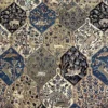 Macro shot of individual hexagonal panels on a Nain wool rug showing detailed gazelles, birds, and flowering trees in blue and ivory.