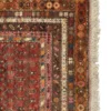 Detailed corner view of a Turkish runner rug showing the geometric border pattern and hand-bound wool fringe.