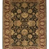 Full overhead view of a 6' x 8' 1" hand-knotted Indian wool rug with a saturated black field and an ornate burgundy-red floral border.
