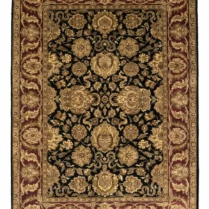 Full overhead view of a 6' x 8' 1" hand-knotted Indian wool rug with a saturated black field and an ornate burgundy-red floral border.