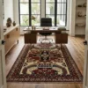 A high-end modern home office featuring a large walnut desk, a black leather executive chair, and a 6x8 Afghan Kazak rug centered on a concrete floor.