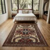A peaceful minimalist bedroom with neutral linens and a walnut bed frame, featuring an Afghan Kazak rug at the foot of the bed on light oak floors.