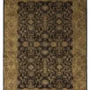 Full overhead view of a 5' 5" x 8' 7" hand-knotted Indian wool rug featuring a deep black field and an ornate terracotta-orange floral border.