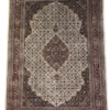 Full overhead view of a 5' 7" x 8' hand-knotted Indian wool rug featuring a large cream multi-lobed medallion on a dark plum and tobacco brown field.