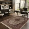 Modern executive office with a dark wood desk and glass windows, featuring a 5' 7" x 8' plum, cream, and tobacco brown Indian wool rug.