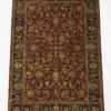 Full overhead view of a 5' 9" x 8' 8" hand-knotted Indian wool rug featuring a deep red field with intricate gold floral patterns and a wide black botanical border.