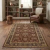 Elegant living room with a neutral sofa and light wood floors, featuring a 5' x 9' ruby red Indian wool rug centered in the space.