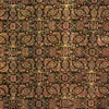 Macro shot of the dense hand-knotted wool pile showing intricate tonal floral motifs in shades of olive, sage, and tan.
