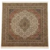 Full overhead view of a 6' 9" x 6' 10" hand-knotted Indian wool rug with a large terracotta and sage medallion on a cream and black field.