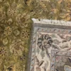 Close-up view of the underside of a yellow Indian wool rug, showing the visible individual hand-tied knots and authentic textile construction.