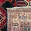 Close-up view of the underside of a Persian Kuliai rug, showing the thick hand-tied knots and authentic wool foundation characteristic of Kurdish weaving.