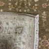 Close-up view of the underside of an Indian Chobi wool rug, showing the visible individual hand-tied knots and authentic textile construction.