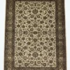 Full overhead view of a 6' x 8' 10" hand-knotted Indian wool rug featuring a symmetrical floral design on a black field with a wide olive-gold border.