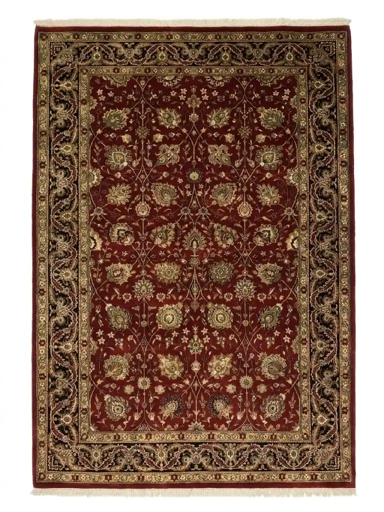 Full overhead view of a 6' x 9' hand-knotted Indian wool rug featuring a saturated ruby red field with intricate gold and ivory scrolling floral patterns and an ornate border.