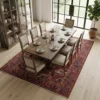 Modern formal dining room with a long oak table and minimalist chairs, featuring an 8x11 Persian Heriz rug as a prestigious centerpiece.
