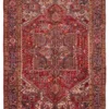 Full overhead view of a 7' 10" x 10' 11" hand-knotted Persian Heriz wool rug featuring a large geometric star medallion on a rich red field with sage accents.