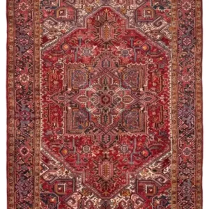 Full overhead view of a 7' 10" x 10' 11" hand-knotted Persian Heriz wool rug featuring a large geometric star medallion on a rich red field with sage accents.