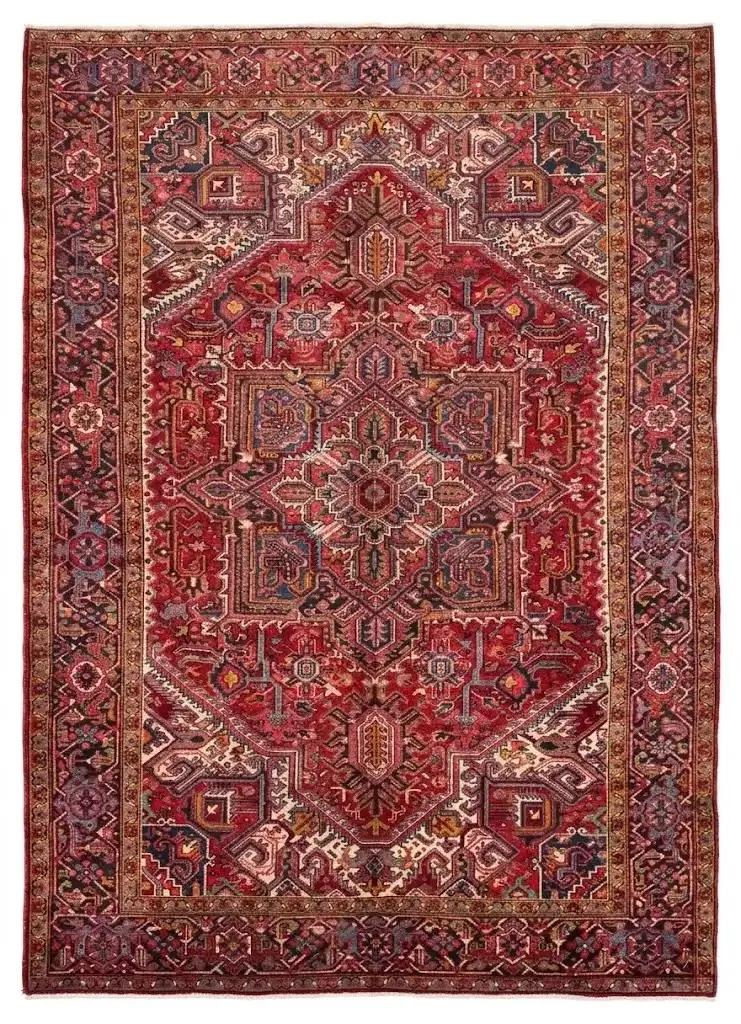 Full overhead view of a 7' 10" x 10' 11" hand-knotted Persian Heriz wool rug featuring a large geometric star medallion on a rich red field with sage accents.