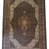 Full overhead view of a 6' 4" x 9' 8" hand-knotted Indian wool rug with a detailed central diamond medallion, dark charcoal field, and stepped cream spandrels.
