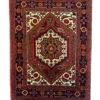 Full overhead view of a 1' 8" x 2' 3" hand-knotted Iranian Gholtogh wool rug with a central geometric medallion and a saturated red field.